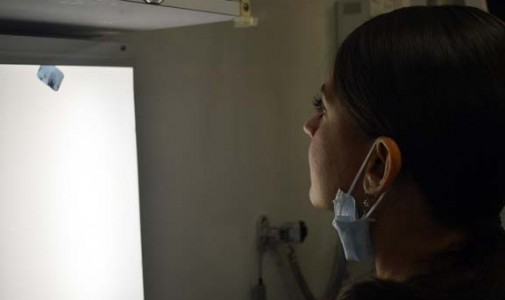 Dr. Ann Marie Maggio, attending dentist, takes a look at a patient’s X-ray.