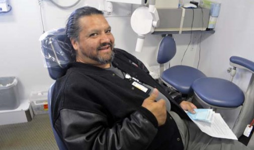 “That’s the best thing about this job—watching people leave happy,” says Omar Abarca, dental assistant and driver.