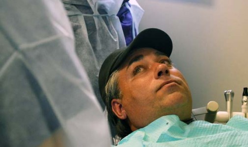 Robert Knapczyk listens to his dentist’s advice prior to his treatment.